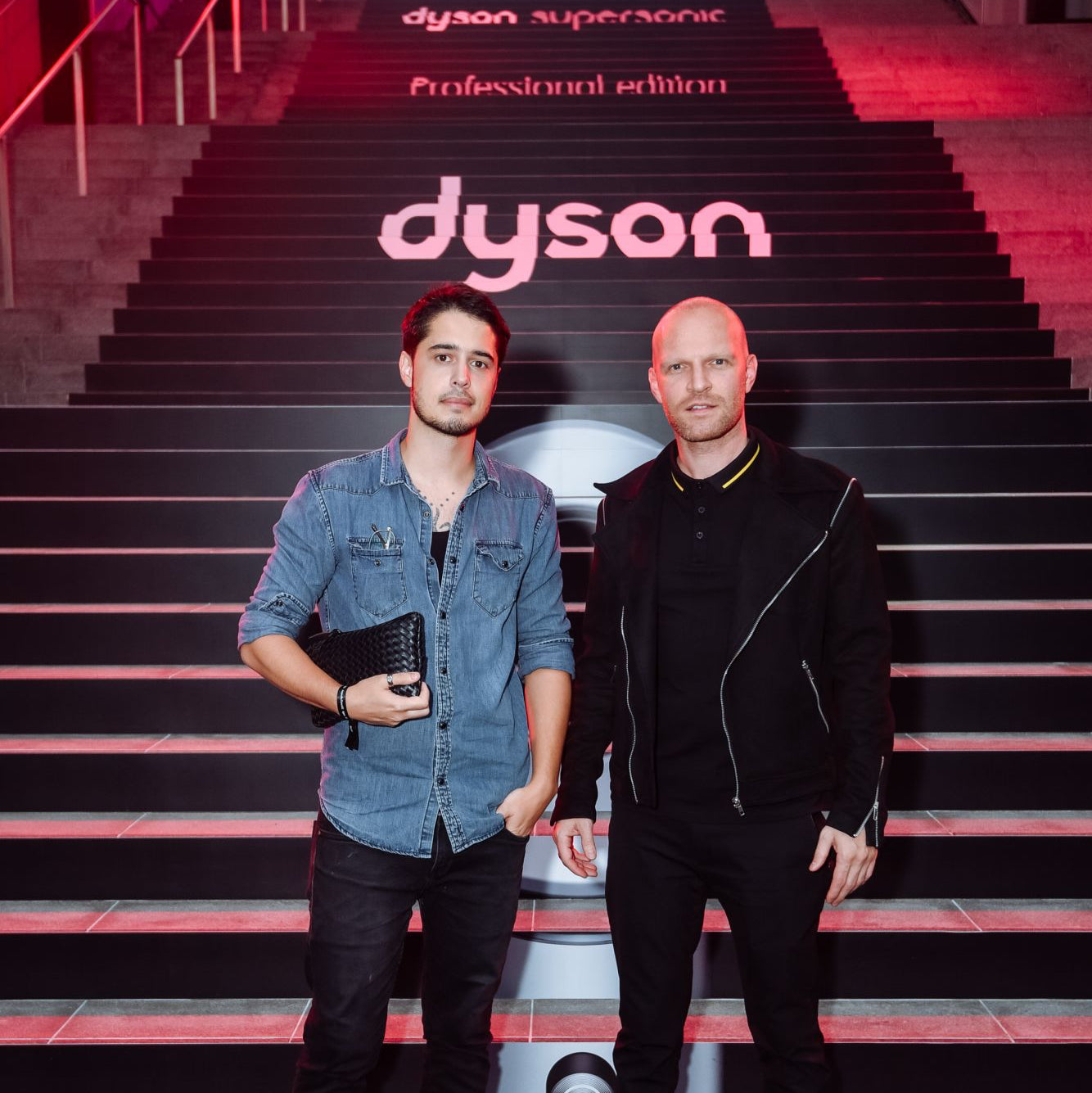 Yann Beyrie posing on red carpet stairs at Dyson's first hair show in Singapore