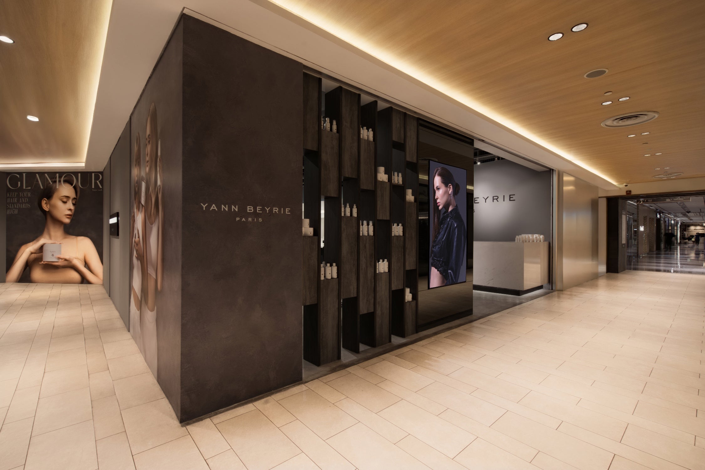 Luxurious storefront entrance and display wall of Yann Beyrie Paris hair salon in Singapore