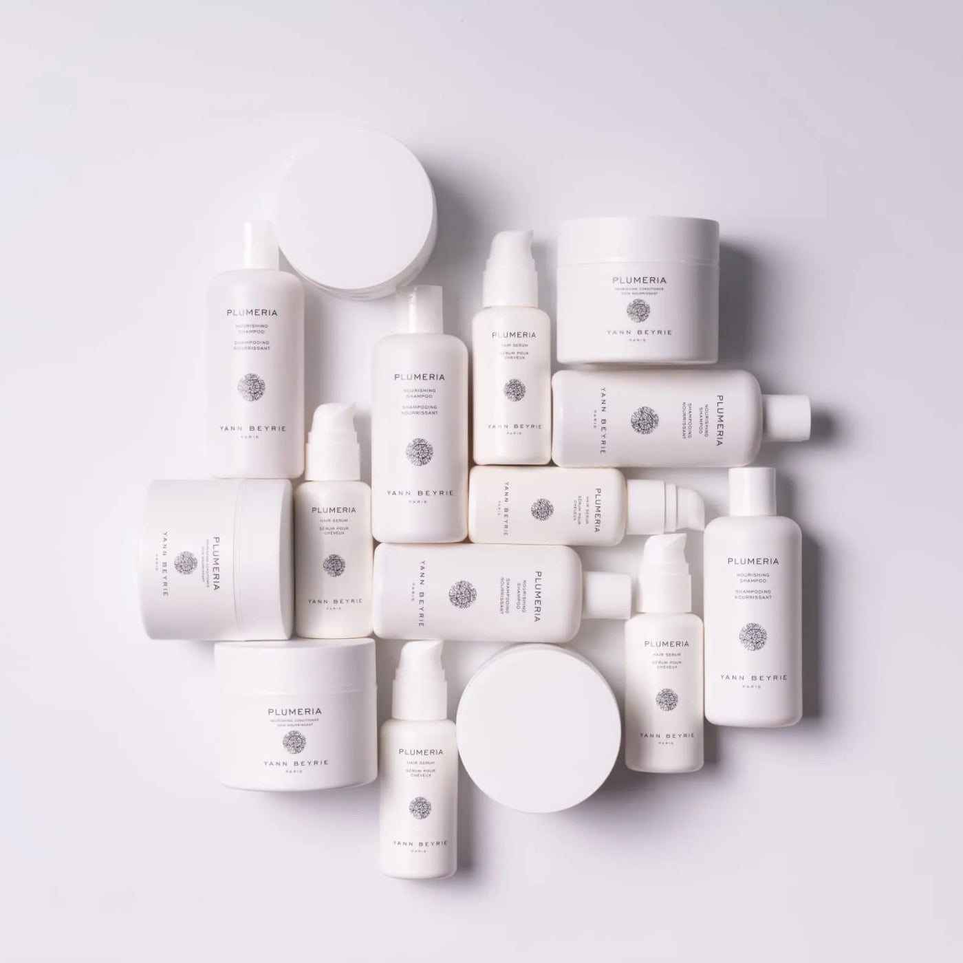 Plumeria by Yann Beyrie haircare product range flatlay featured in Prestige Singapore