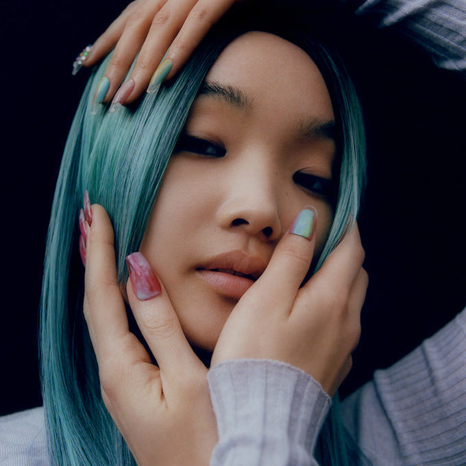 Model with mint green hair and pastel nails for Dyson Hair Care masterclass