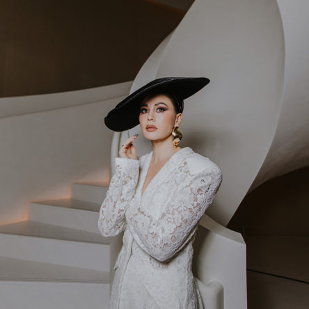 Host Yvette King wearing a white lace suit for Next In Vogue Gala