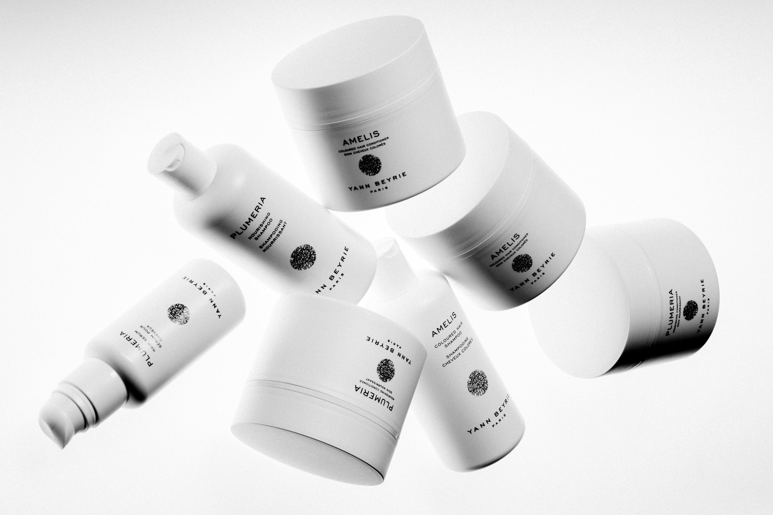Floating 3D layout of Yann Beyrie Paris haircare products including Plumeria and Amelis lines